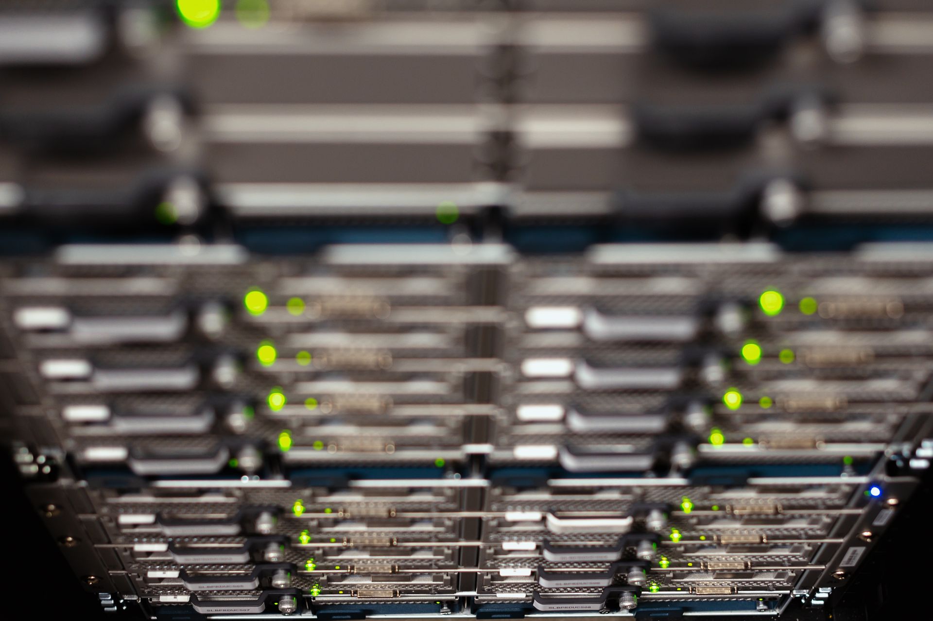 Dark server storage trays with green status LEDs, the hardware behind HPOS order queries