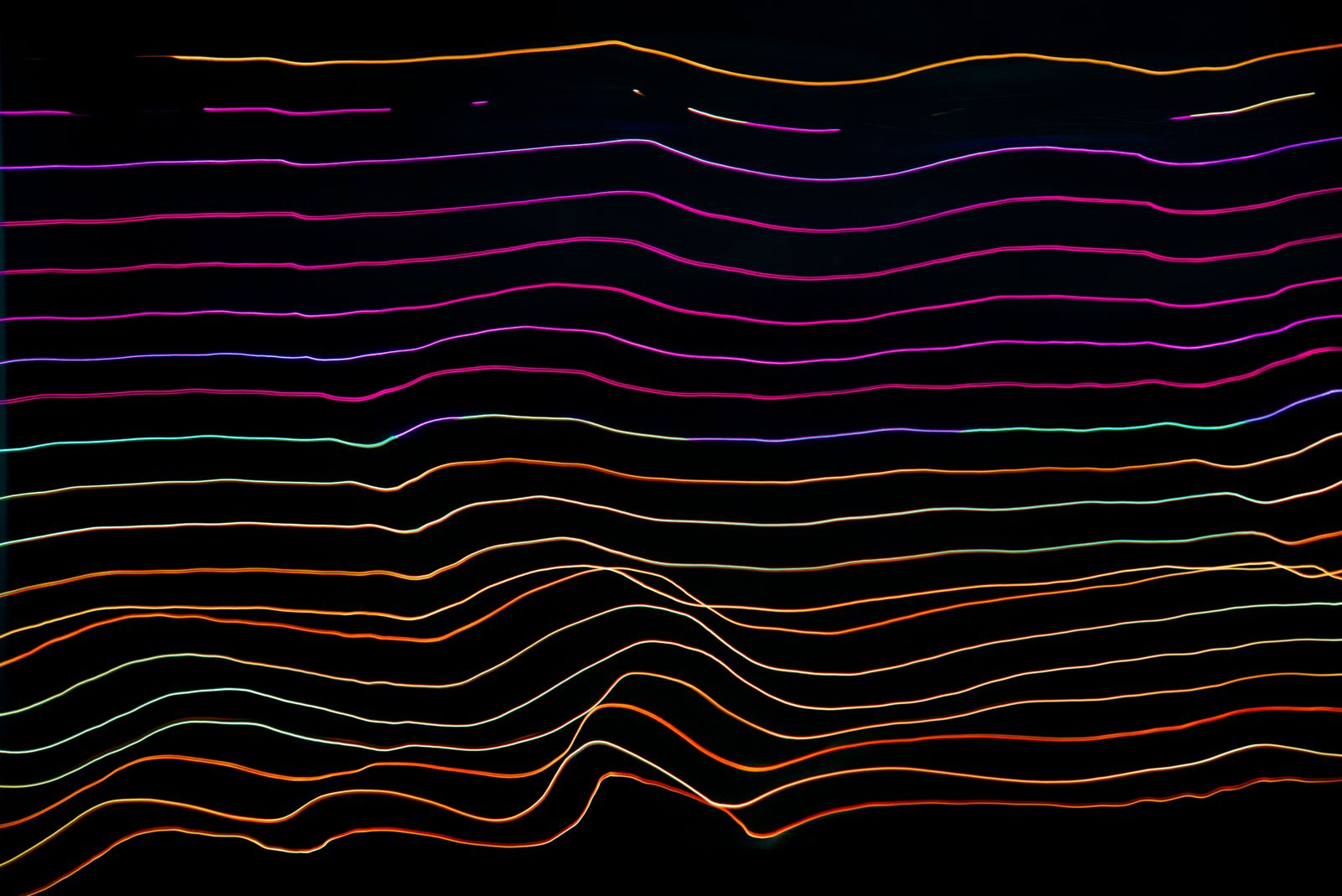 Multicolored light-trail waveforms visualizing fluctuating data in stochastic programming