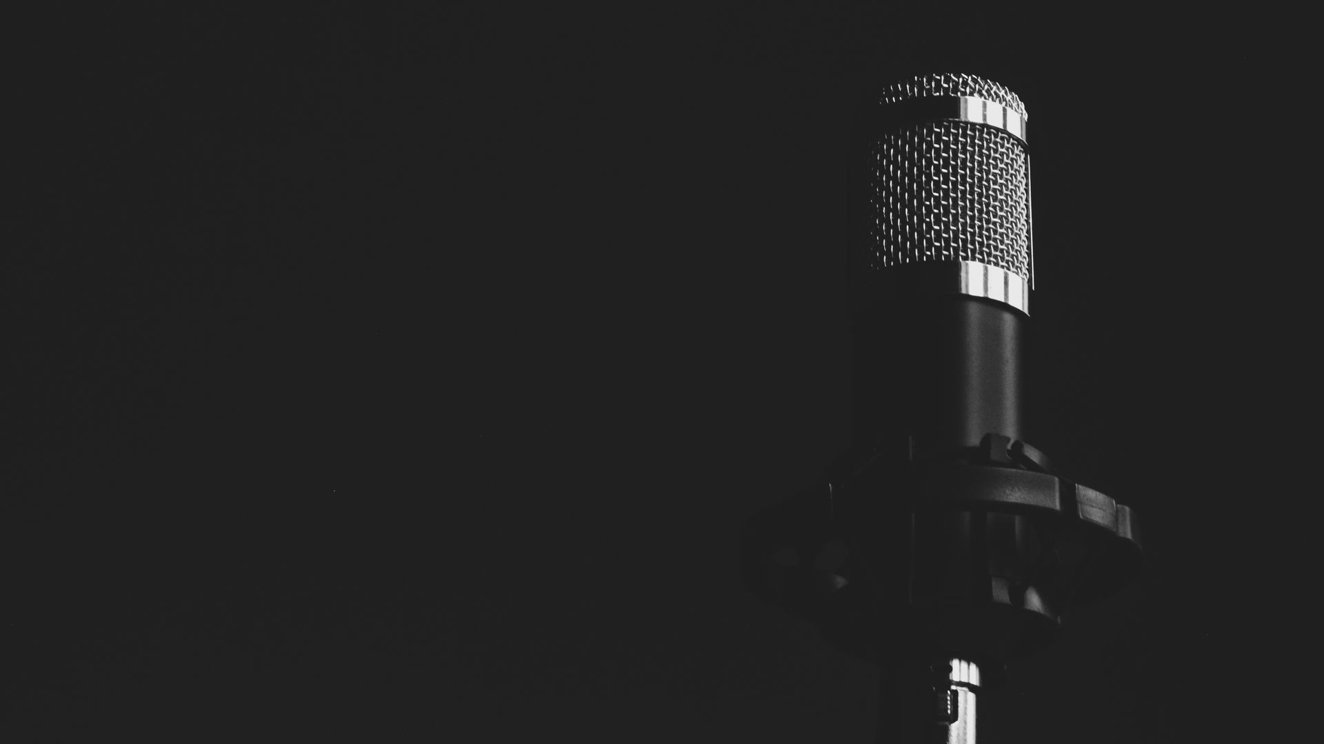 Studio microphone in grayscale representing the WordCamp US 2026 call for speakers