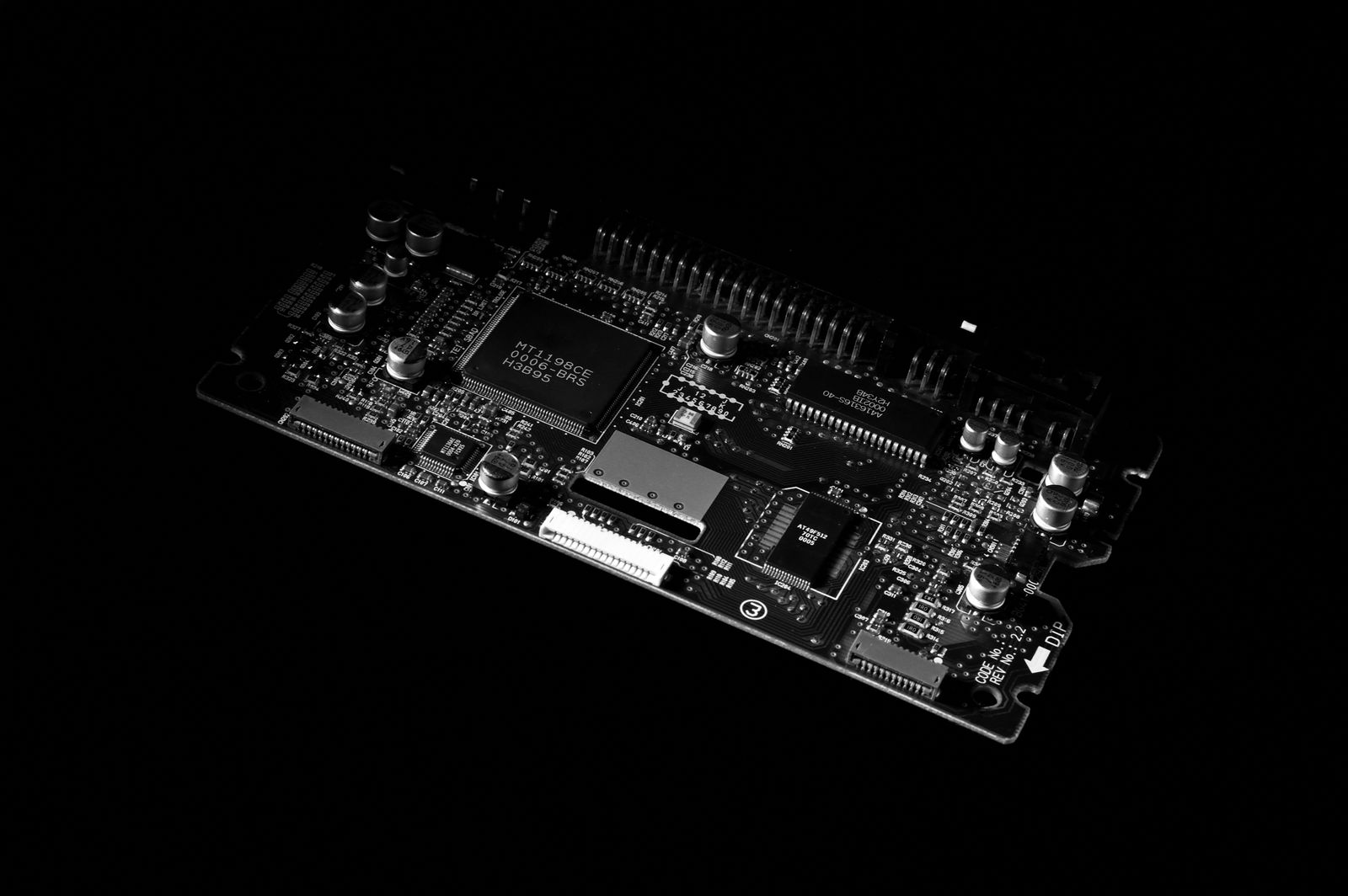 Close-up of a printed circuit board and chip representing IoT hardware constraints