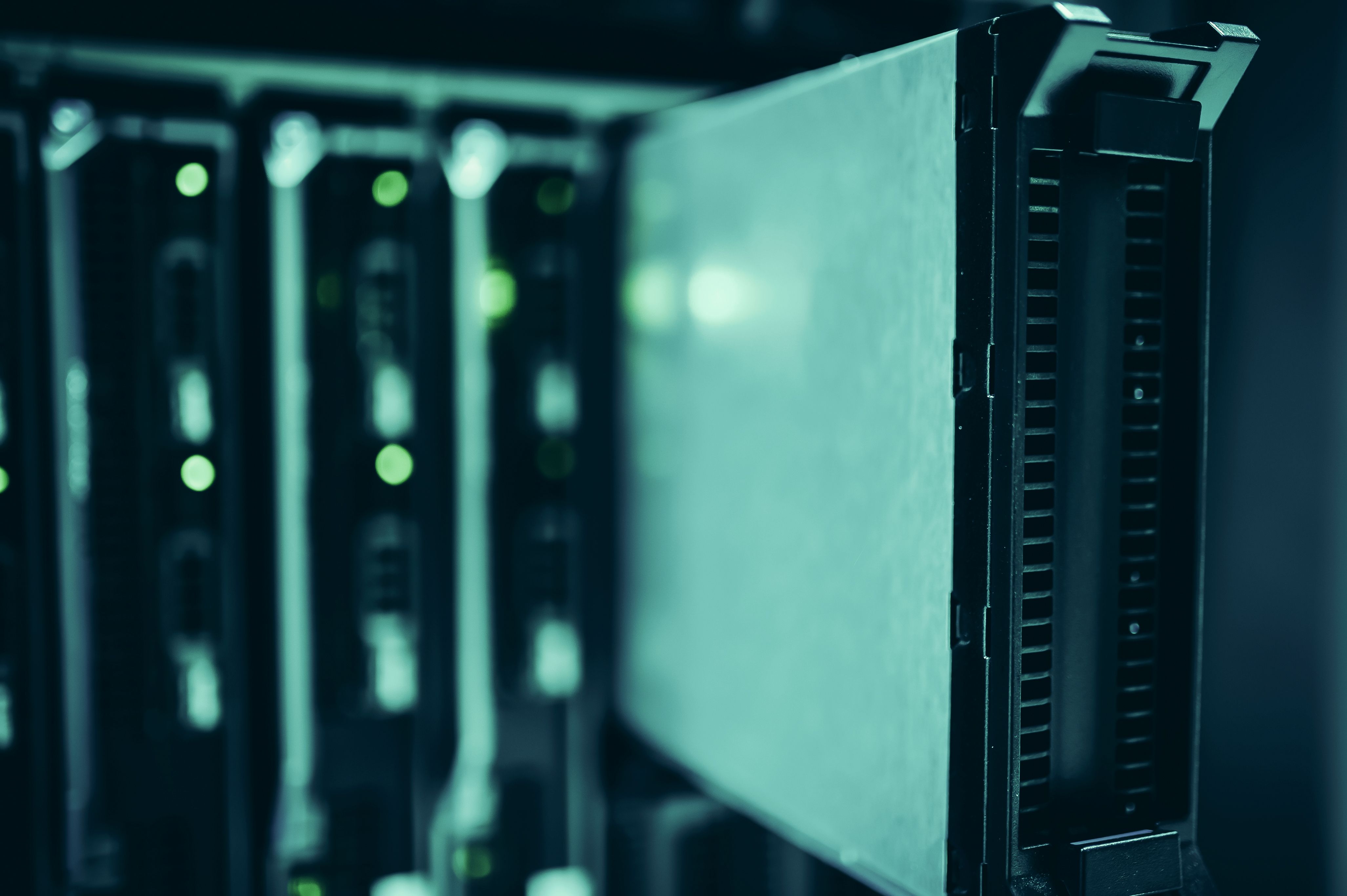 Technician pulling a drive from parallel server rack storage bays