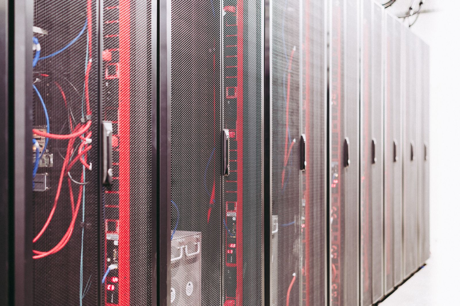 Data center server racks with cabling illustrating WordPress core performance infrastructure