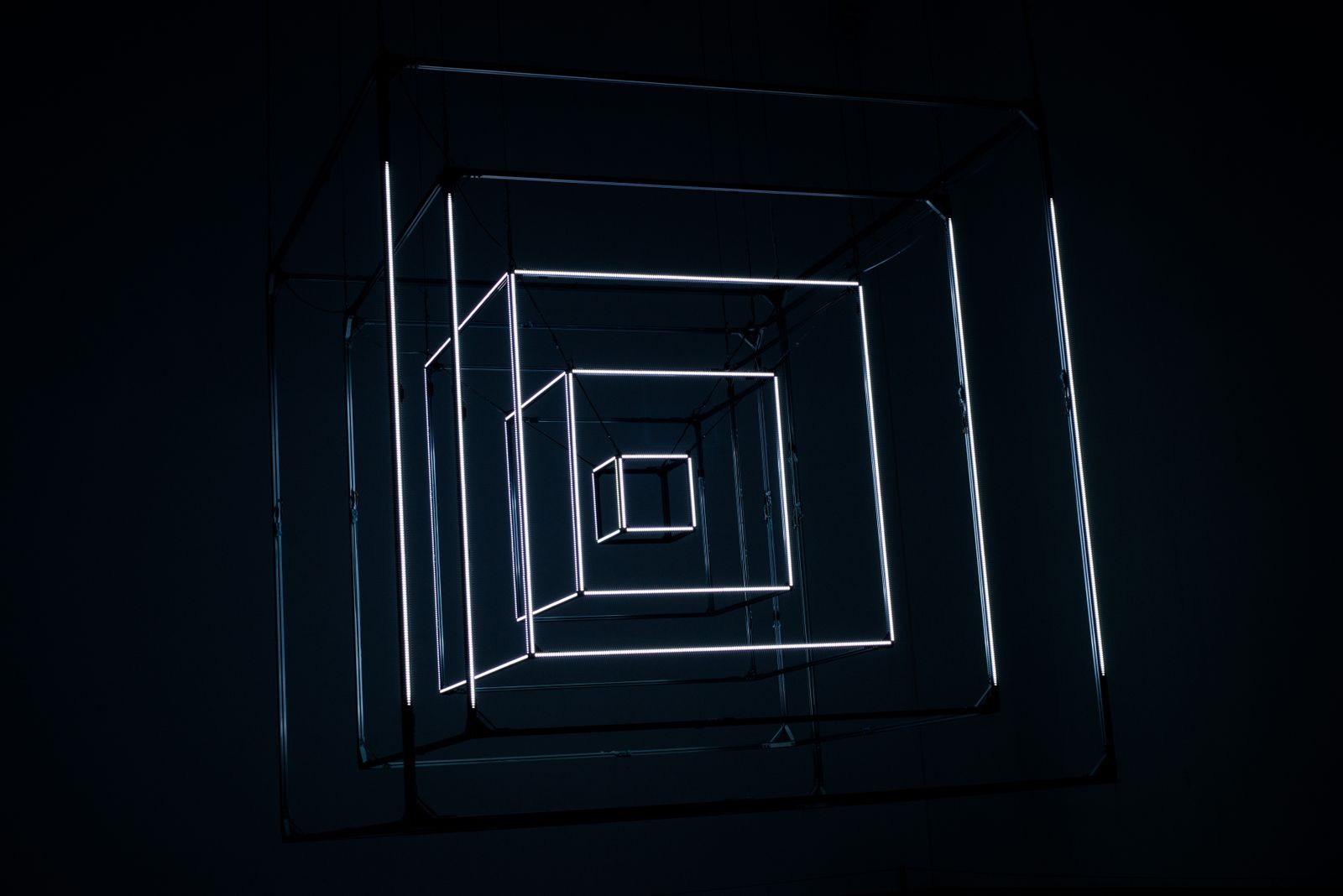 Glowing nested cube frames receding in depth, illustrating the Apple Vision Pro animation in CSS