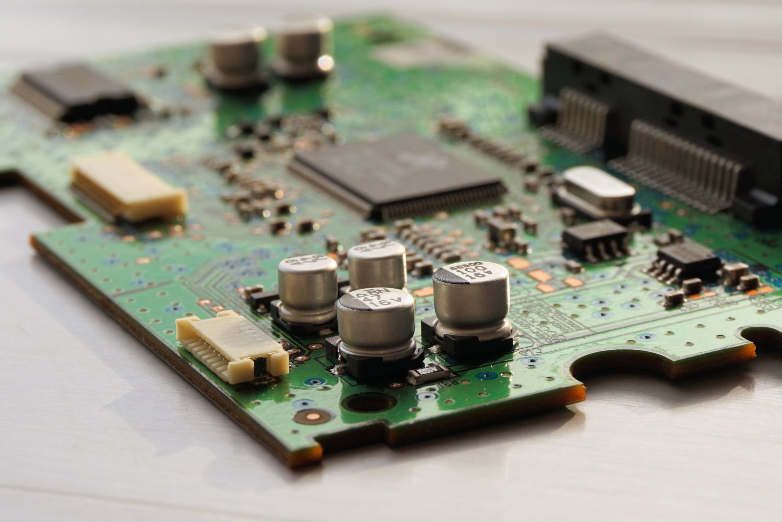 Macro close-up of a green circuit board illustrating robust, well-engineered code architecture