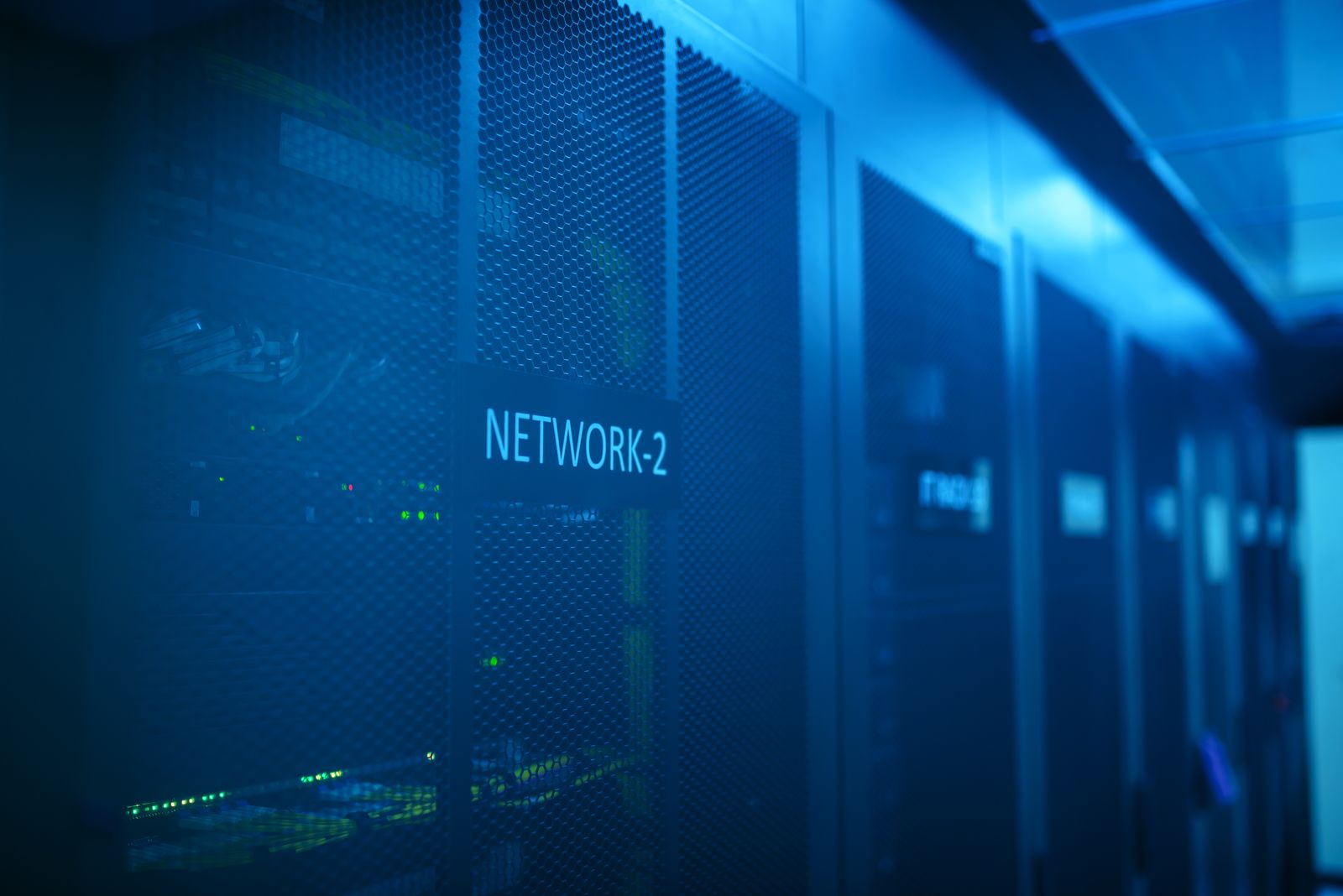 Server racks glowing with blue light, symbolizing a hardened defense against a supply chain attack