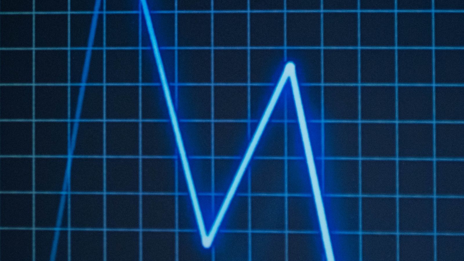 Glowing blue zigzag line chart on a dark grid, illustrating Titanic dataset analysis patterns